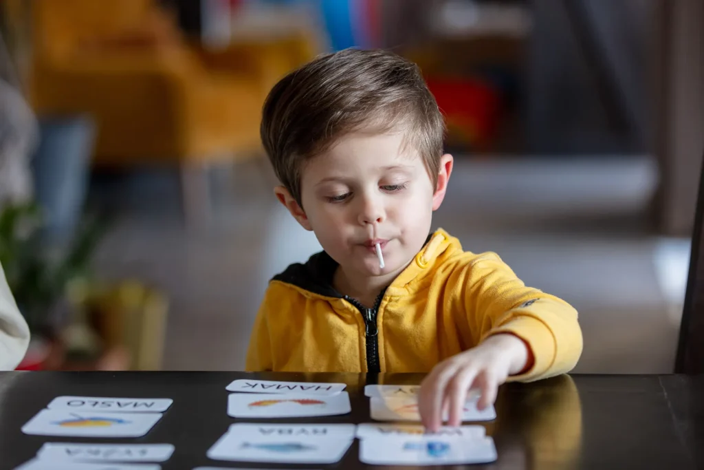 little boy working on a matching exercise